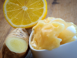 ginger root, honey and lemon on wooden rustic table.