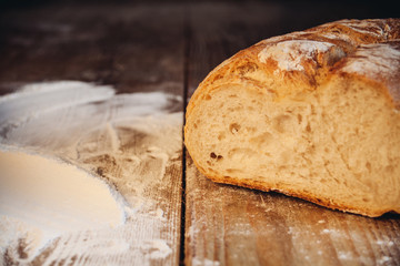 bread and flour on wooden table