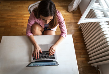 Young female working on her blog