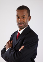 Black businessman with arms folded