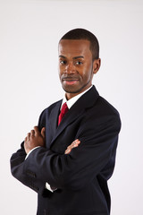 Black businessman with arms folded