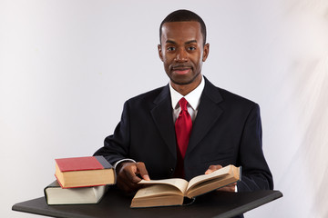 Black businessman reading a book