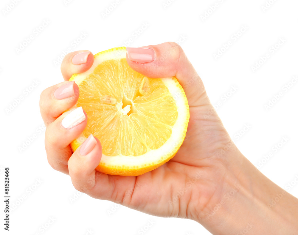 Poster Female hand squeezing lemon isolated on white