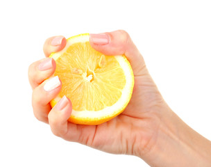 Female hand squeezing lemon isolated on white
