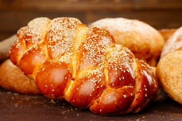 Different bread on wooden background