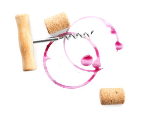 Wine stains, corks and corkscrew  isolated on white