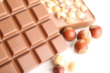 Milk chocolate bars with hazelnuts close up