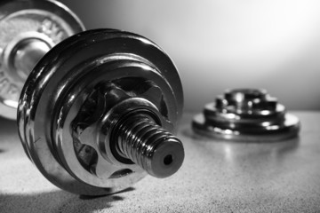 Dumbbell on gray background