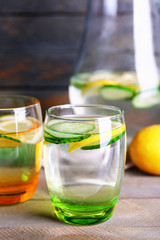 Fototapeta na wymiar Fresh water with lemon and cucumber in glassware