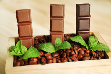 Still life with set of chocolate in wooden box of coffee