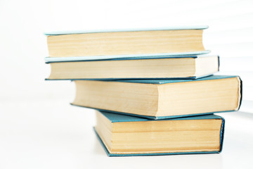 Books on white windowsill, close up