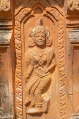 Fototapeta na wymiar the ancient stone carving for dancing deva on the pagoda