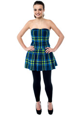 Attractive young girl with hands on waist