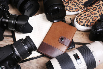 Still life with modern cameras on wooden table, closeup