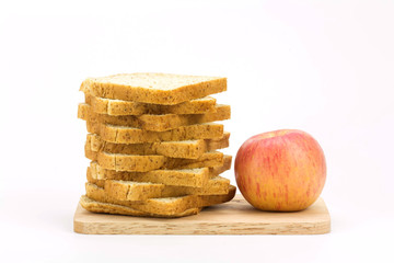bread and apple isolated on white background
