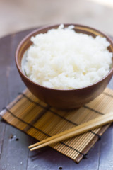 Steamed rice in a bowl and chopstick