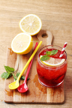 cold red soft drink from raspberry syrup and mint