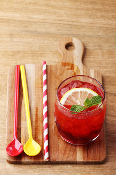 cold red soft drink from raspberry syrup and mint