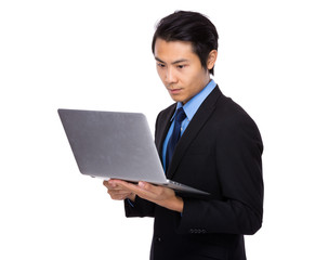 Young business man using laptop