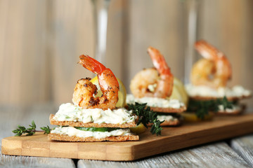 Appetizer canape with shrimp and cucumber