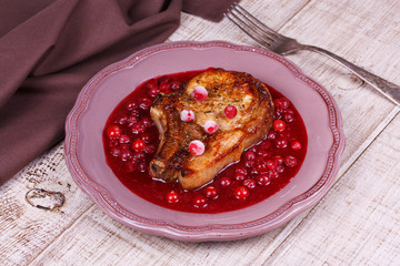 Fried pork chop with cranberry and wine sauce