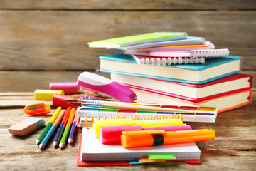 Bright school stationery on old wooden table