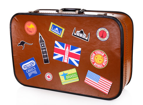 Suitcase with stickers isolated on white