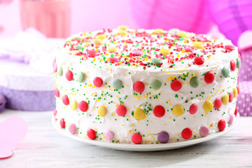 Birthday cake on colorful background