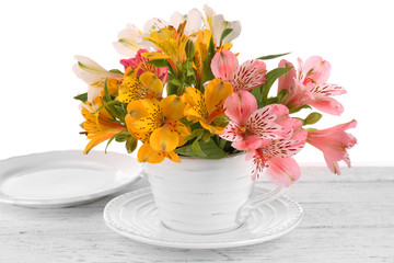 Table setting with flowers, isolated on white