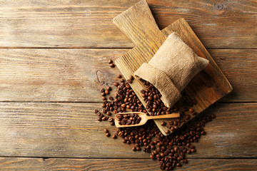 Coffee beans on wooden background