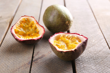 Passion fruits on wooden background