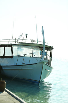 Yacht berth in ocean water in resort