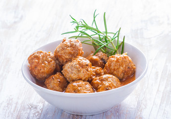Bowl with meatballs and tomato sauce