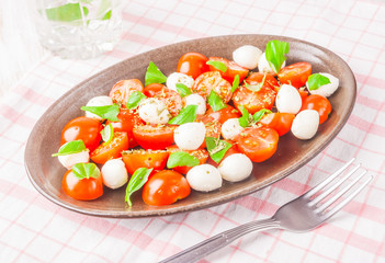salad with tomatoes, mozzarella and fresh basil