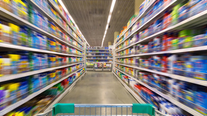Shopping Cart View on a Supermarket Aisle and Shelves - Image Ha