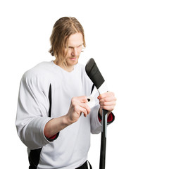 Hockey player taping stick