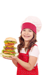 happy little girl cook with big hamburger