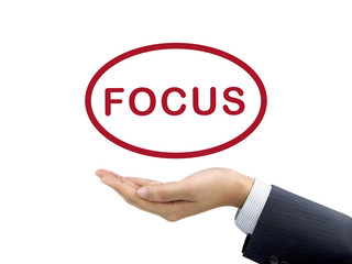 focus word holding by businessman's hand