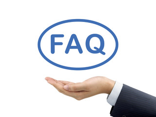 FAQ word holding by businessman's hand