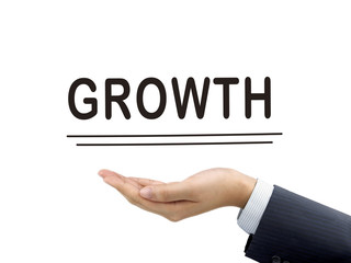 growth word holding by businessman's hand