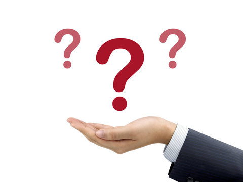 question mark icon holding by businessman's hand