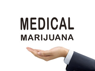 medical marijuana words holding by businessman's hand