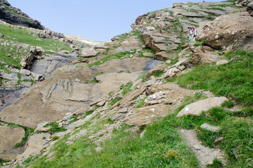 Fototapeta na wymiar Girl hiking in the Spanish Pyrenees (GR11 trail)