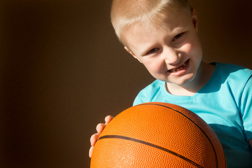 Child (boy) with basketball