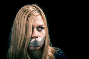 Kidnapped woman hostage with tape over her mouth