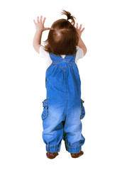 Child stands with hands up, isolated on white. Back view