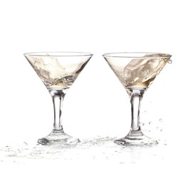 two wine swirling in a goblet martini glass, isolated