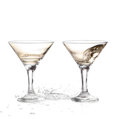 two wine swirling in a goblet martini glass, isolated