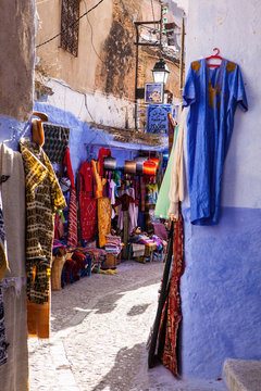 street with colorful clothing, Chefchaouen, Morocco