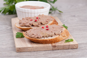 liver pate with pink pepper on toasted bread